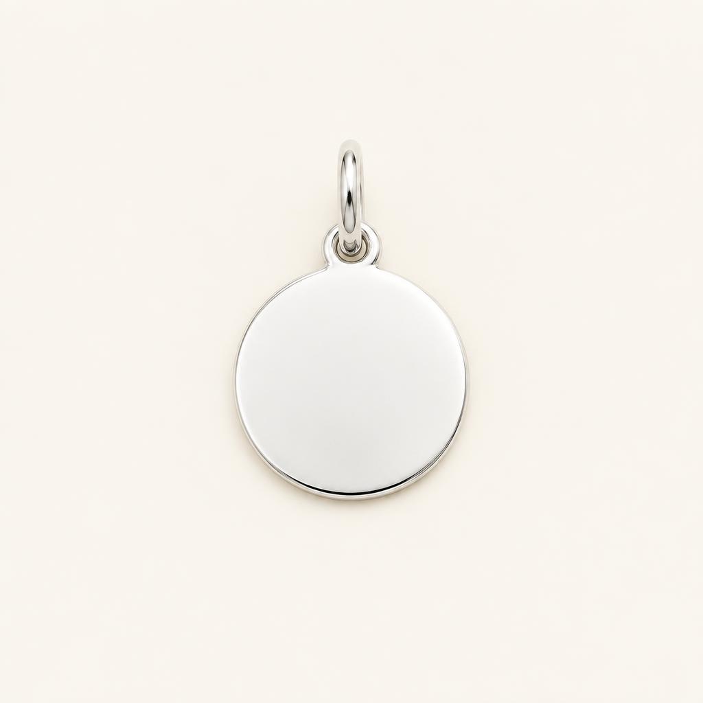 Blank charm in sterling silver with an empty face for engraving